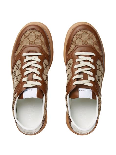 gucci brown leather trainers|Gucci embossed low top.